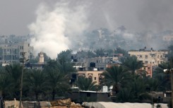 Smoke rises above Khan Yunis in southern Gaza as Israeli troops engage in ground combat in the city