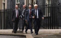 Johnson's handling of the government's response to the pandemic has been criticised, including by his former chief scientific adviser Patrick Vallance (second right)