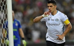 Luis Suarez celebrates after scoring the second of two goals in his farewell appearance for Gremio in a 3-2 win over Fluminense at the Maracana Stadium