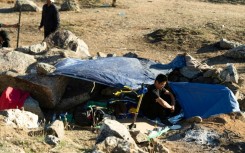 'A new normal': Migrants huddle in open-air camps on US border