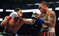 Devin Haney punches Regis Prograis on the way to a unanimous decision victory to take Prograis's  WBC super-lightweight world title