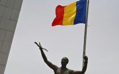 In Chad's capital N'Djamena, the national flag flies on April 23, 2021, marking the state funeral for its late president Idriss Deby