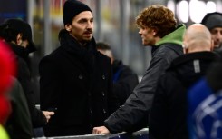 Zlatan Ibrahimovic speaks with Italian tennis star Jannik Sinner before Milan's recent defeat to Borussia Dortmund
