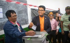 President Andry Rajoelina casts his ballot in Madagascar's national election clouded by opposition protests