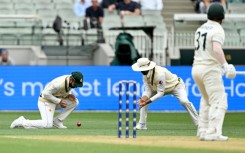 Pakistan's Abdullah Shafique (L) drops a catch from Australian batsman David Warner (R)