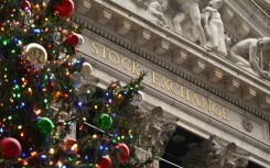 Holiday gains on the New York Stock Exchange helped drive an uptick in Asian stocks Wednesday