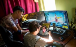 Maria Elena Arevalo talks to her TikTok followers, accompanied by her grandson Hector Carrasco