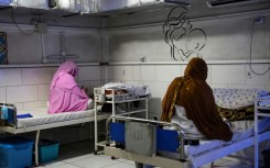 Afghan women sit beside their newborns at the Doctors Without Borders (MSF)-run maternity hospital in Khost