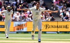 Australian bowler Pat Cummins (C) celebrates another wicket against Pakistan