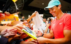 Spain's Rafael Nadal signs autographs during a promotional event ahead of the Brisbane International