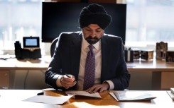 World Bank President Ajay Banga works at his desk at the World Bank headquarters in Washington, DC, on January 3, 2024