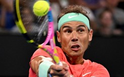 Spain's Rafael Nadal hits a return against Austria's Dominic Thiem at the Brisbane International