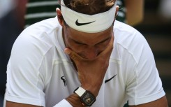 Hurt: Nadal at Wimbledon in 2022 where he had to forfeit his semi-final with an abdominal tear