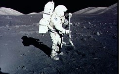 Astronaut Harrison Schmitt collects lunar rake samples at the Taurus-Littrow landing site on the moon during the Apollo 17 mission, America's last lunar landing