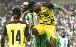 Nigeria star Victor Osimhen (2L) in an aerial clash during a 2022 World Cup qualifier against Ghana in Abuja.