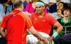 Spain's Rafael Nadal receives treatment for his hip at the Brisbane International
