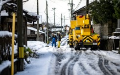 Japanese authorities have warned the weight of the snow could cause more buildings to collapse in the earthquake-hit areas