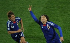 Yasuhito Endo (R) celebrates with Yasuhito Okubo after scoring as Japan beat Denmark at the 2010 World Cup 