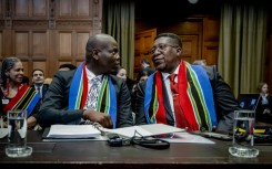 No armed attack, no matter how serious, could justify Israel's response, Justice Minister Ronald Lamola (left) told the court