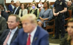 New York Attorney General Letitia James in court behind Donald Trump