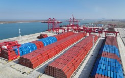 China's exports and imports dropped last year, though trade with Russia soared 