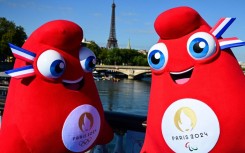 The cheery Olympics mascots contrast with the 'gloomy mood' of the country