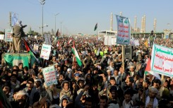 Hundreds of thousands of people, some carrying Kalashnikov assault rifles, gathered in Yemen's capital Sanaa on Friday to protest