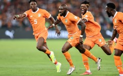 Seko Fofana runs away in celebration after scoring the opening goal of the Africa Cup of Nations for hosts Ivory Coast
