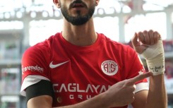Israeli forward Sagiv Jehezkel displays a bandage reading "100 days. 07/10" after scoring a goal during a Turkish Super league match