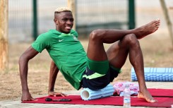 Napoli striker Osimhen does some stretches during a Nigerian training session in Abidjan on Monday