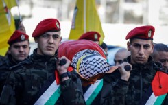 Palestinian Authority National Security officers in Nablus, the Israeli-occupied West Bank, carry the body of Yazan Najami during his funeral procession after five fighters from the Al-Aqsa Martyrs' Brigades were killed