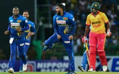 Sri Lanka's Wanindu Hasaranga (2R) celebrates taking the wicket of Zimbabwe's Richard Ngarava (R) in the third and final Twenty20 international in Colombo