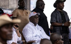 DR Congo President Felix Tshisekedi (C) officially swept the election to win a second term