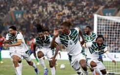 Christopher Wooh (3R) celebrates after scoring the winning goal for Cameroon against Gambia.
