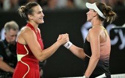 Aryna Sabalenka (L) shakes hands with Barbora Krejcikova after beating her in the Australian Open  quarter-finals