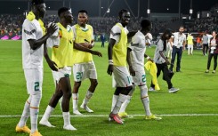 Senegal players celebrate after beating Guinea 2-0 in Yamoussoukro