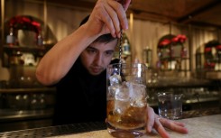 A bartender prepares a non-alcoholic cocktail in Riyadh