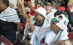 People react in Pretoria after watching a screening of proceedings at the ICJ