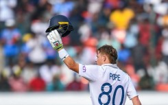 England's Ollie Pope celebrates after scoring a century 