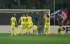 Villarreal's players celebrate their thrilling 5-3 victory over Barcelona in La Liga on Saturday at the Olympic Stadium