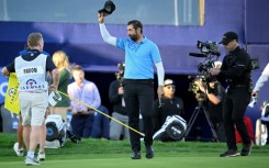 Matthieu Pavon of France waves to the crowd after winning the Farmers Insurance Open at Torrey Pines