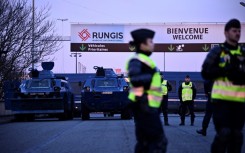 Gendarmes have parked armoured vehicles in front of the massive Rugnis wholesale food market outside Paris