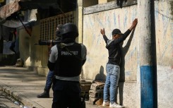 Haitian police arrest a man in the Turgeau commune of Port-au-Prince during gang-related violence in April 2023