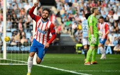 Girona forward Portu celebrates after scoring his team's winning goal at Celta Vigo which sent the Catalans top again