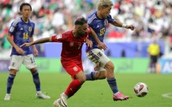 Japan beat Bahrain in their Asian Cup last 16 game in Doha to set up a quarter-final against either Iran or Syria