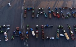 Farmers formed the slogan 'mangez francais' ('eat French') on the A6 motorway outside Lyon