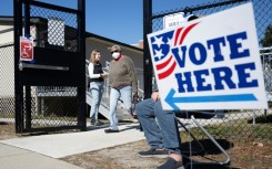 A woman departs a polling location at Stiles Point Elementary in Charleston, South Carolina during the Democratic primary