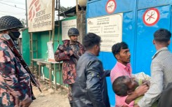 A man with bullet wounds is carried into a Doctors Without Borders hospital in Bangladesh after fighting just across the frontier with Myanmar 