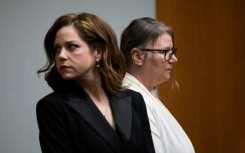 Jennifer Crumbley (R), the mother of Oxford High School shooter Ethan Crumbley, and her attorney Shannon Smith (L)