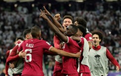 Almoez Ali (C) celebrates with his Qatar teammates after scoring the winner